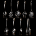 Okura 9-piece utensil set in black, rounded handles, black studio