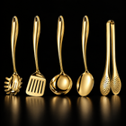 Okura 5-piece utensil set in gold, rounded handles, black studio