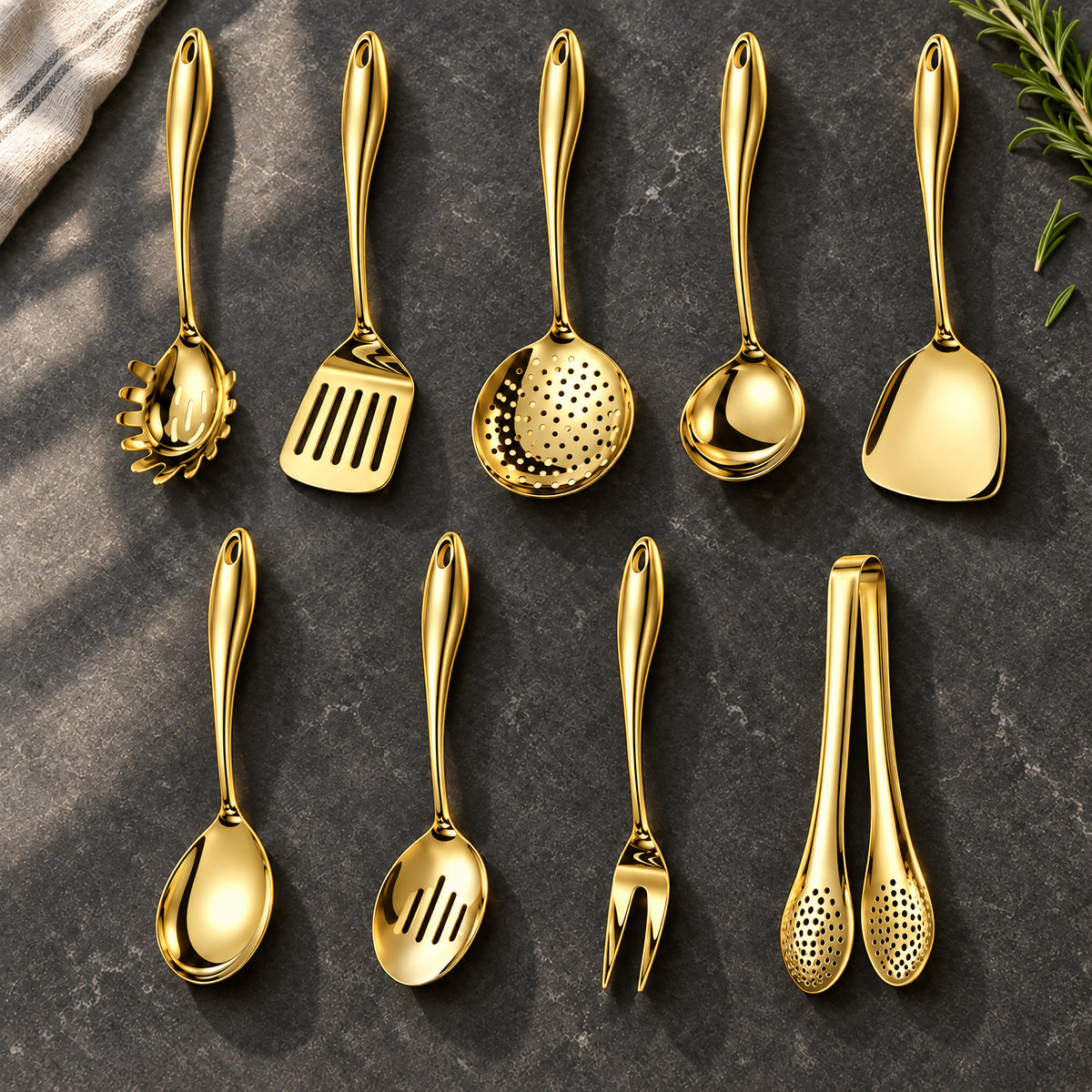 Okura 9-piece utensil set in gold arranged on a charcoal kitchen countertop