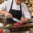 A Japanese chef using the Ryujin Santoku Knife on a wooden cutting board in a professional kitchen