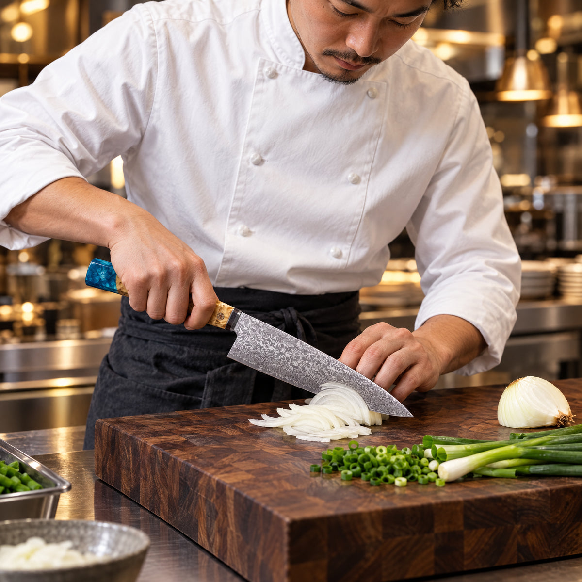 A Japanese chef using the Suijin 9-Inch Gyuto Chef Knife on a wooden cutting board in a professional kitchen