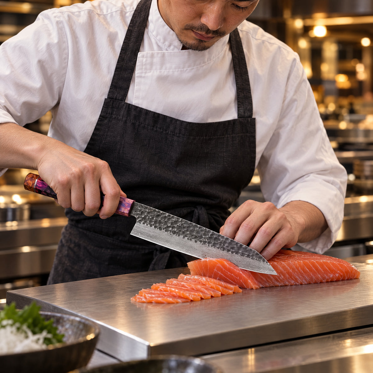 A Japanese chef using the Kazan Kiritsuke Knife on a titanium cutting board in a professional kitchen
