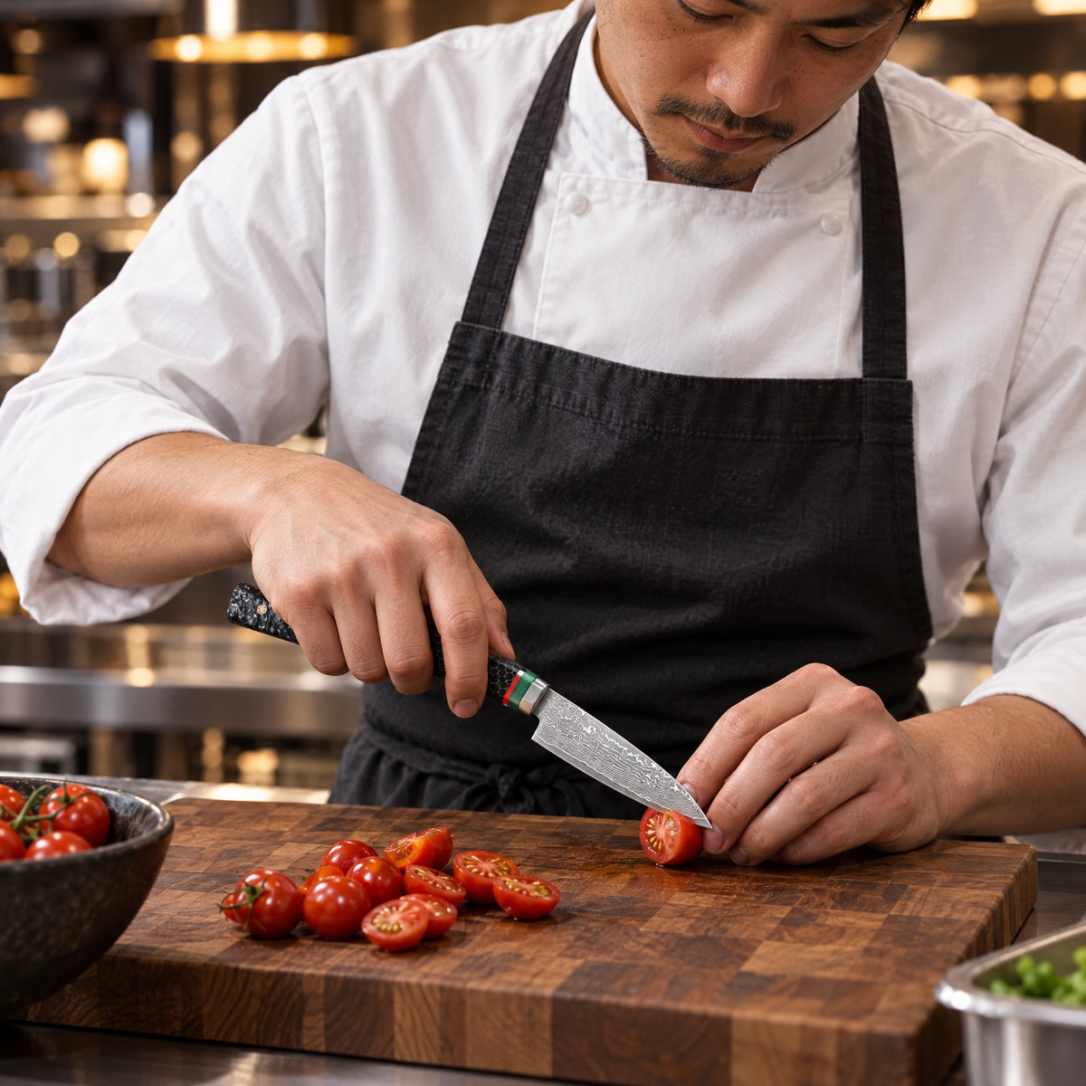 A Japanese chef using the Shingen Paring Knife on a wooden cutting board in a professional kitchen