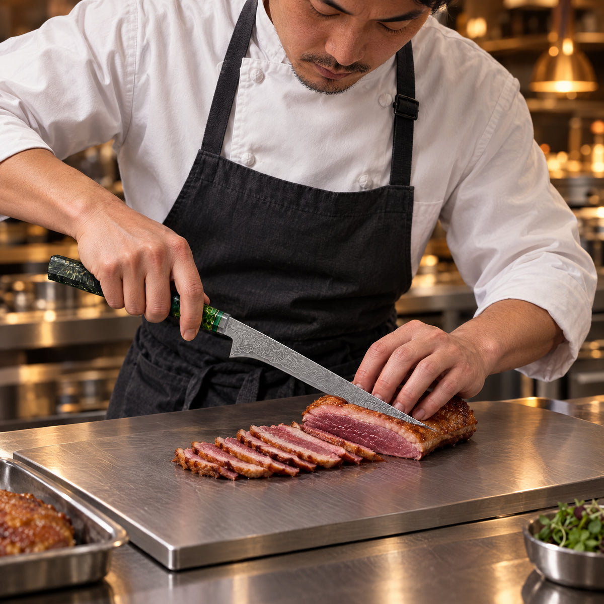 A Japanese chef using the Ibuki Honesuki Boning Knife on a titanium cutting board in a professional kitchen