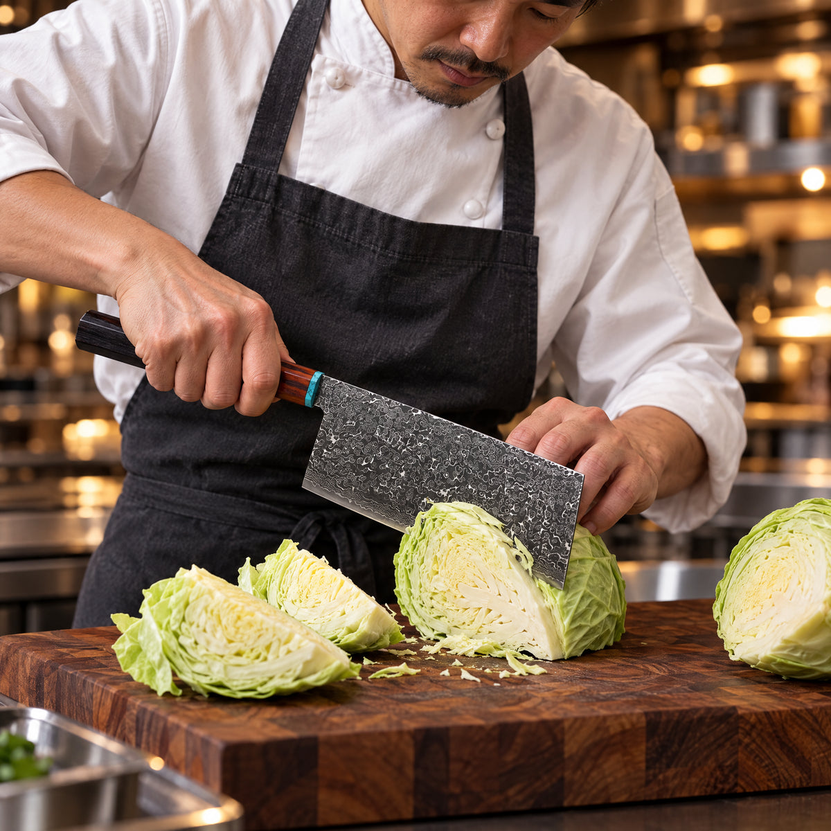 A Japanese chef using the Arashi Cleaver Knife on a wooden cutting board in a professional kitchen