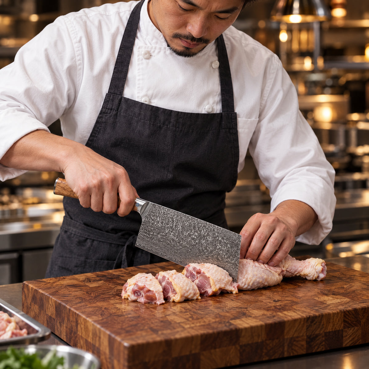 A Japanese chef using the Yamato Cleaver Knife on a wooden cutting board in a professional kitchen