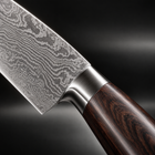 Close-up of the hakugin damascus knife set blade and handle