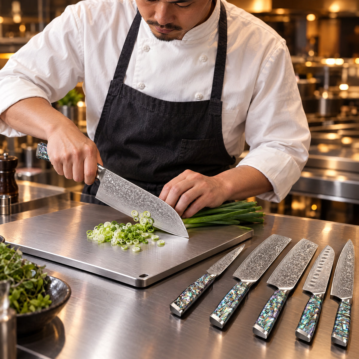 A Japanese chef using the Ryujin Damascus Knife Set on a titanium cutting board in a professional kitchen