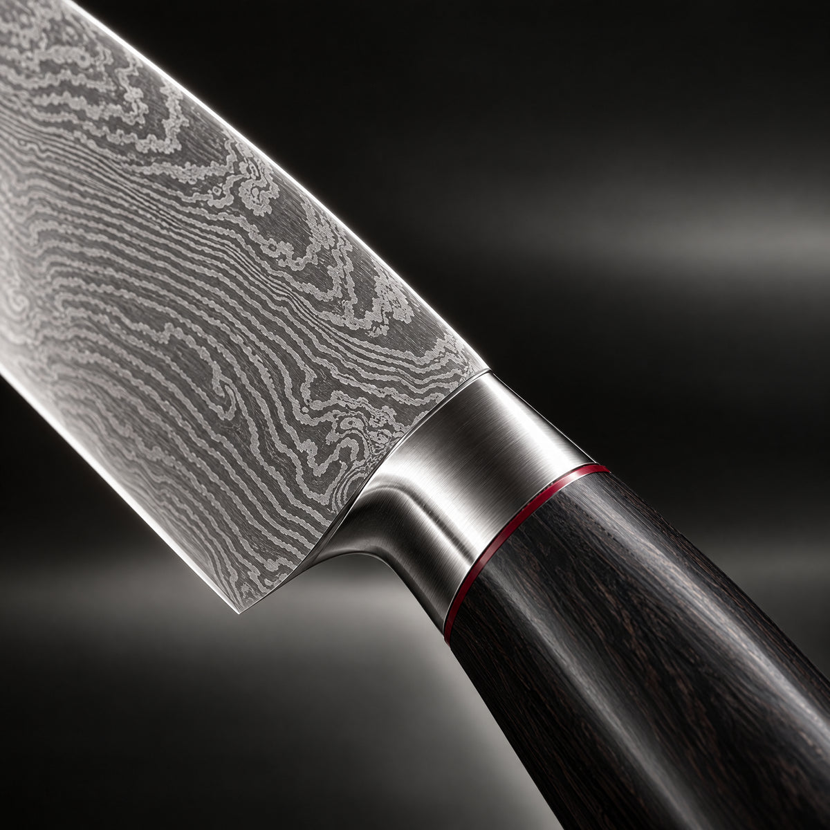 Close-up of the kurogane 2-piece knife set (santoku & petty) blade and handle