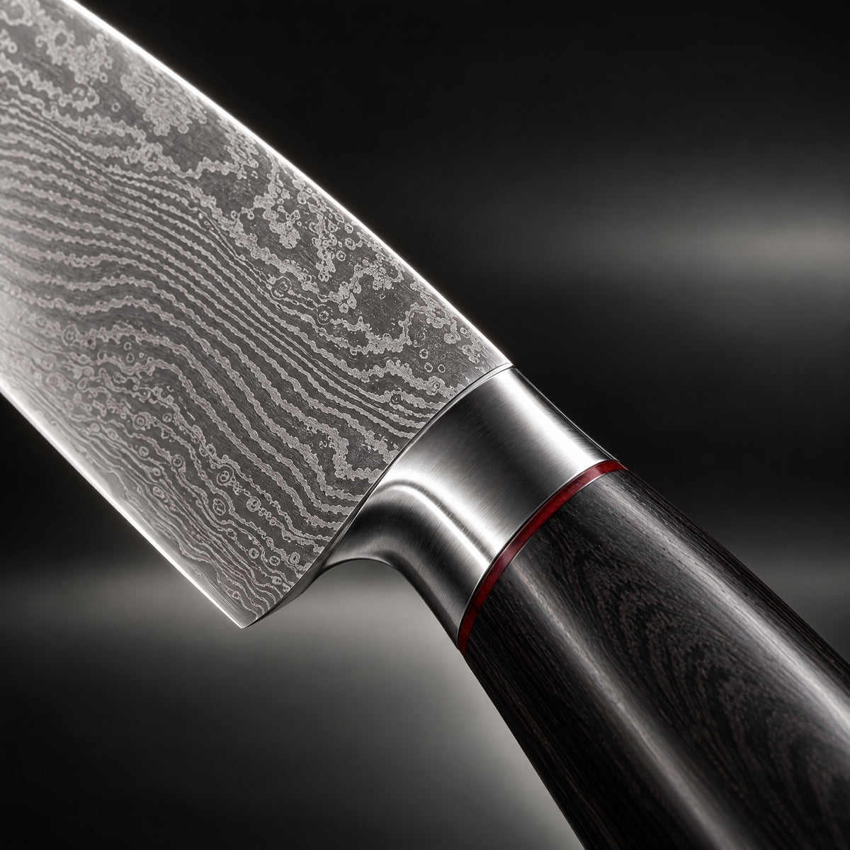 Close-up of the kurogane damascus knife set blade and handle