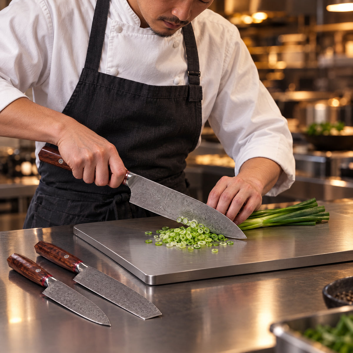 A Japanese chef using the Takamori 2-Piece Knife Set (Gyuto & Nakiri) on a titanium cutting board in a professional kitchen
