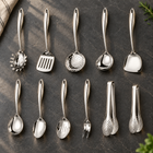Okura 11-piece utensil set arranged on a charcoal kitchen countertop