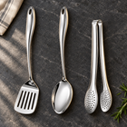 Okura 3-piece utensil set arranged on a charcoal kitchen countertop