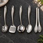 Okura 5-piece utensil set arranged on a charcoal kitchen countertop