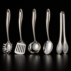 Okura 5-piece utensil set, rounded handles, black studio with subtle warm lighting