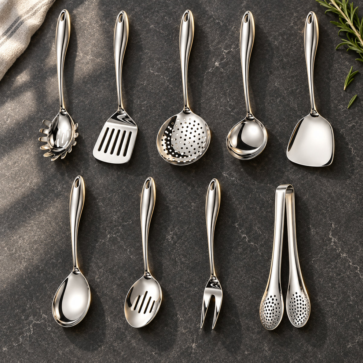 Okura 9-piece utensil set arranged on a charcoal kitchen countertop