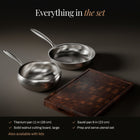 Everything in the pan and sauté set with walnut board