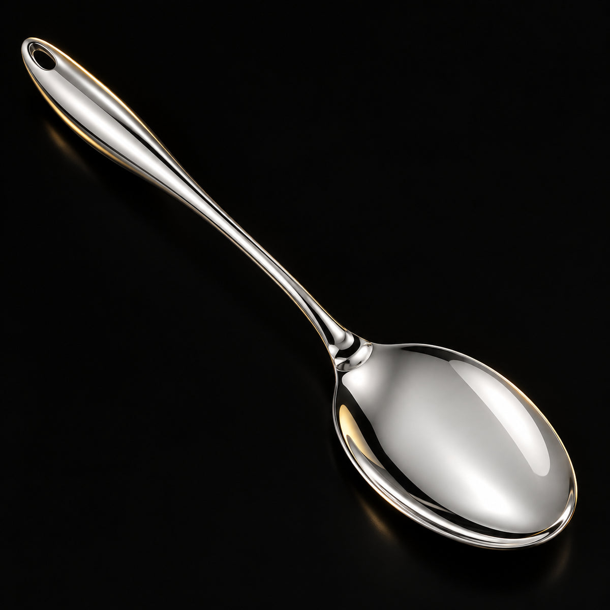 Solid serving spoon with rounded handle, dark studio detail