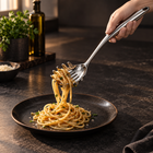 Rounded-handle pasta server plating spaghetti