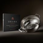 Okura deep titanium pot next to the Okura gift box