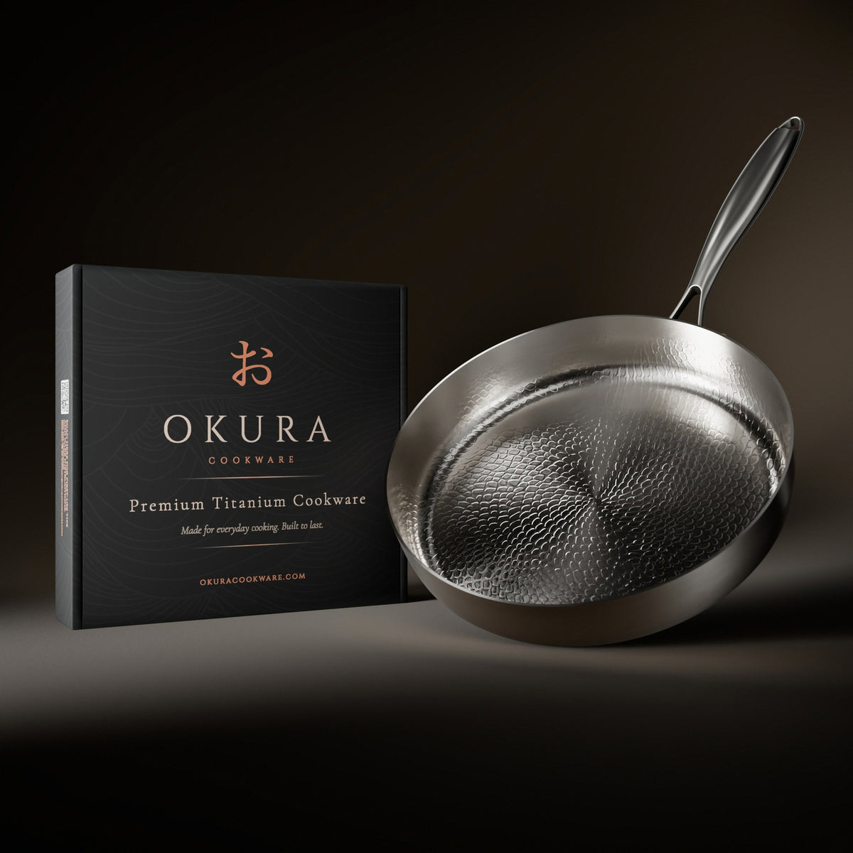 Okura high-wall titanium pan next to the Okura gift box