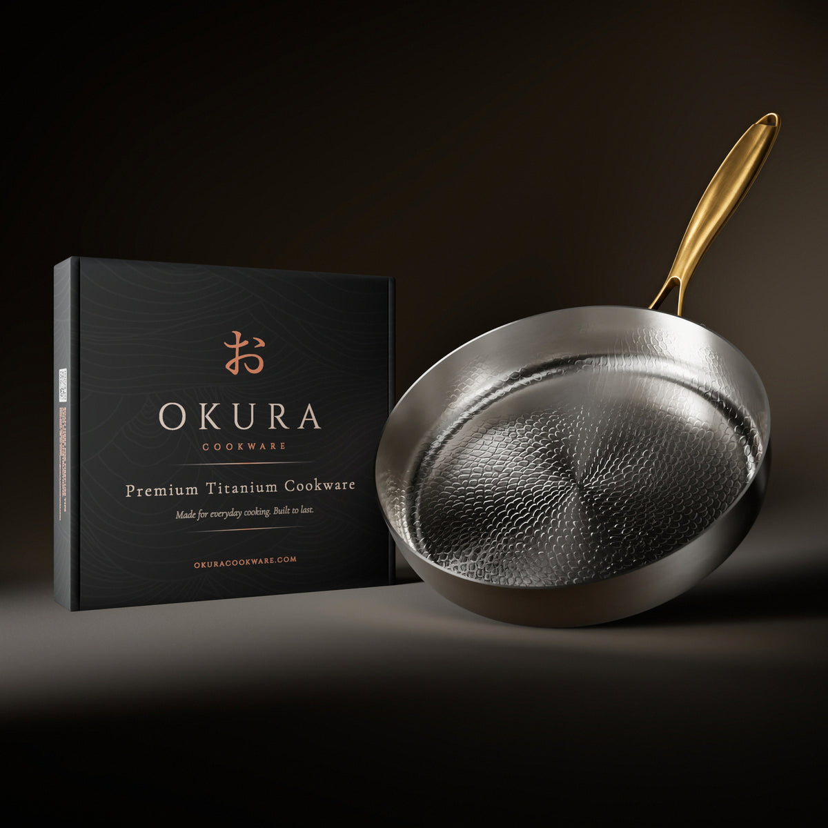 Okura high-wall titanium pan Limited Edition next to the Okura gift box