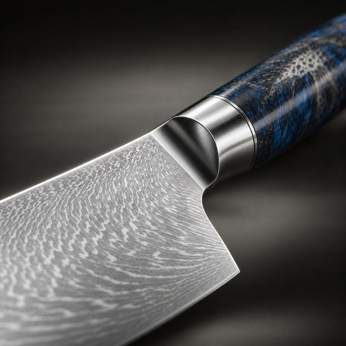 Close-up of the japanese-style hammered chef’s knife blade and handle