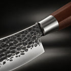 Close-up of the japanese-style hammered stainless steel chef’s knife blade and handle