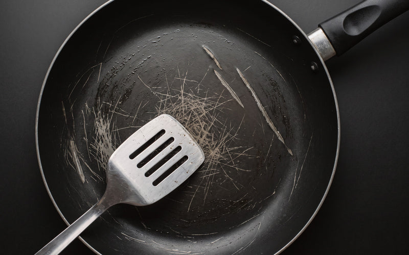 Non-stick pan scratched by a metal spatula