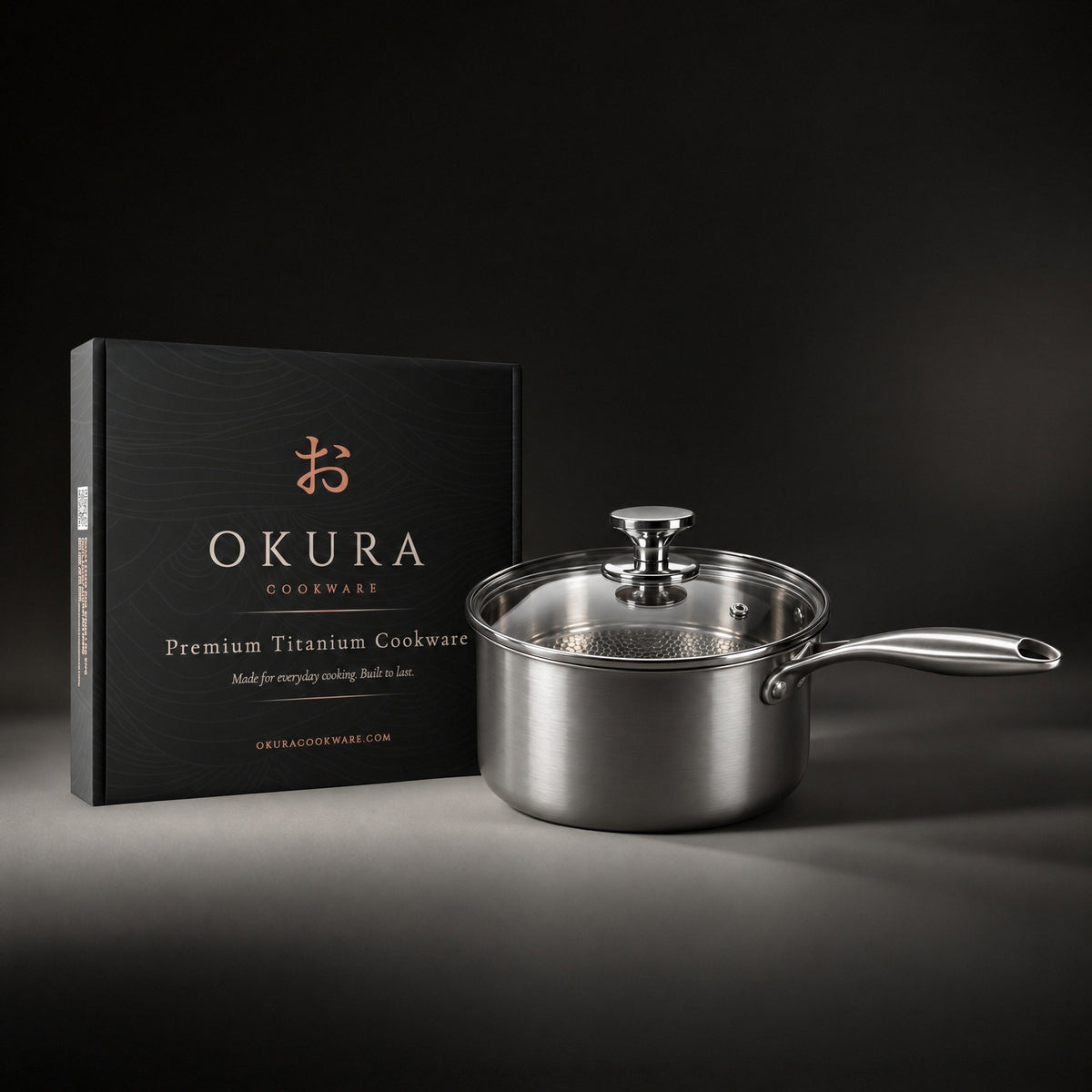 Okura titanium saucepan next to the Okura gift box