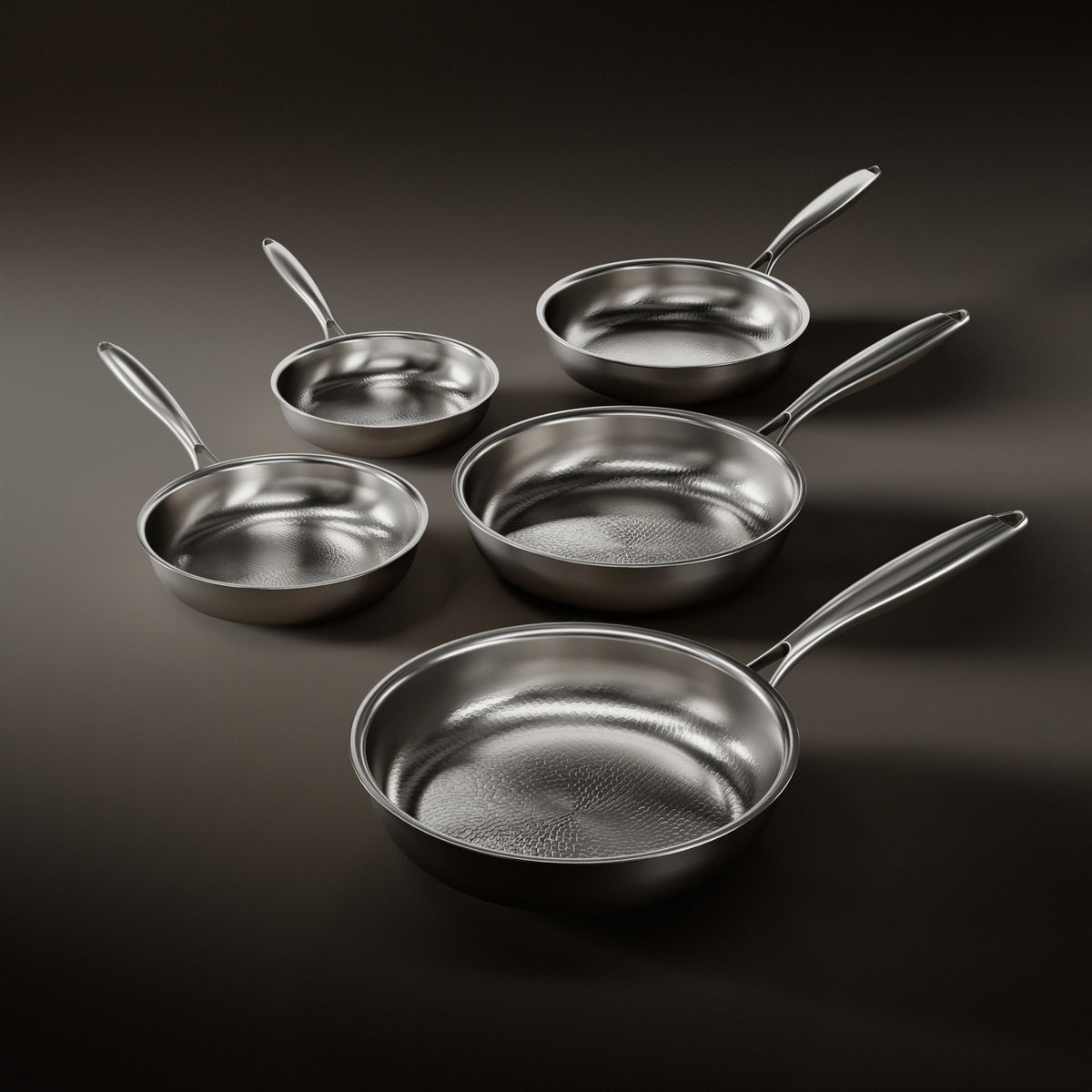Five Okura hand-hammered titanium frying pans, 8 to 12 inch